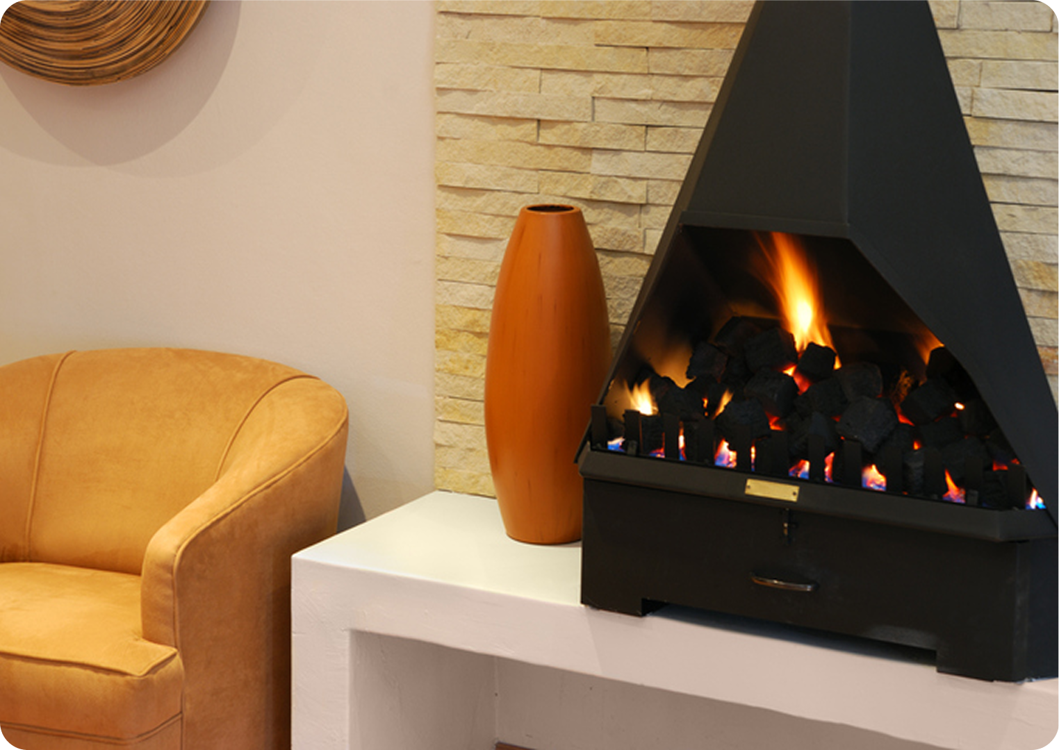 Cozy living room with fireplace and chair.