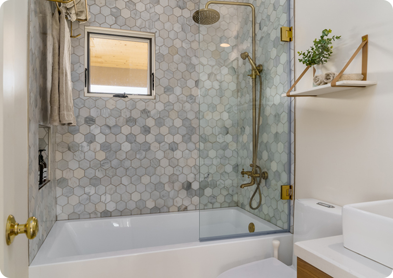 Modern bathroom with hexagonal tile shower wall.