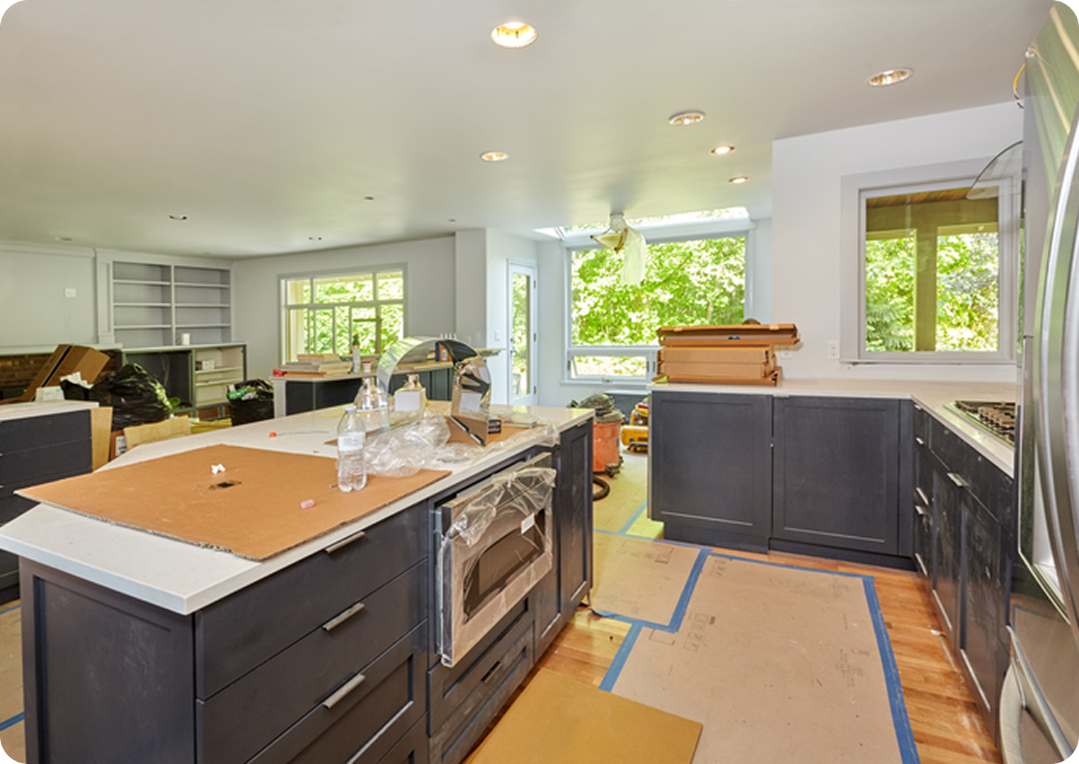 Modern kitchen under renovation with natural light.
