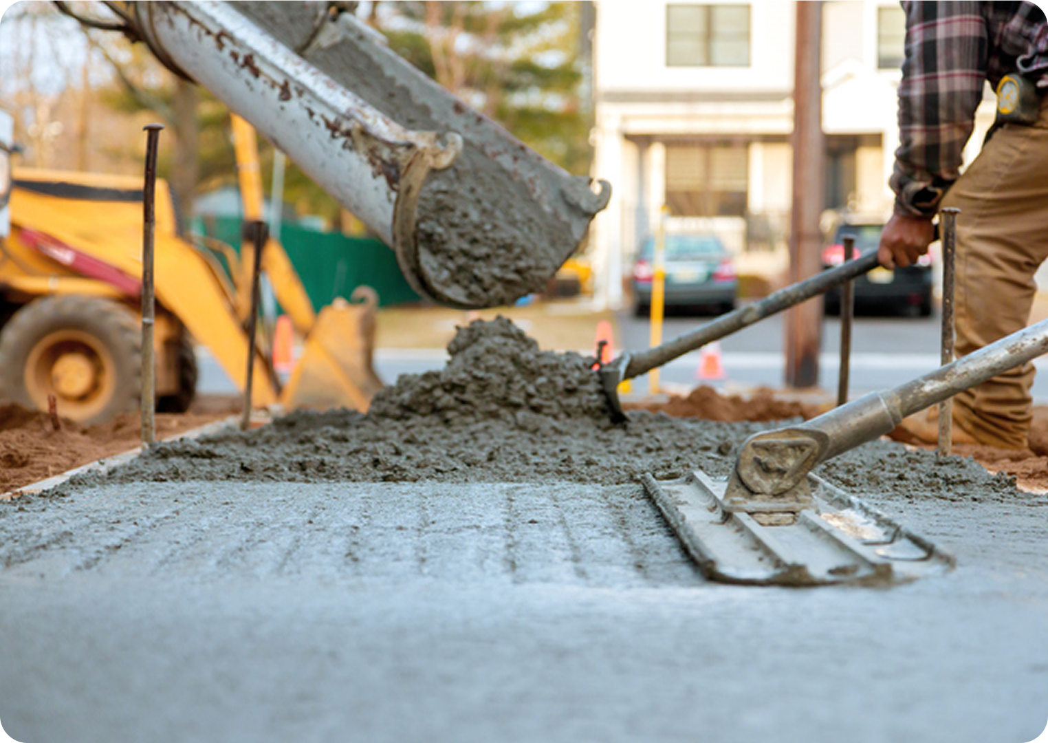 Pouring and smoothing concrete on sidewalk.